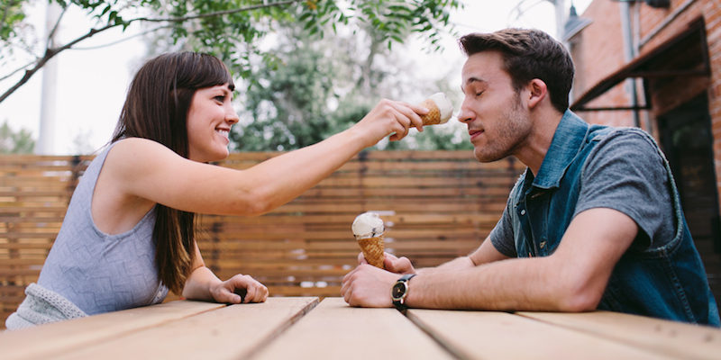 Couple enjoys ice cream and fun.