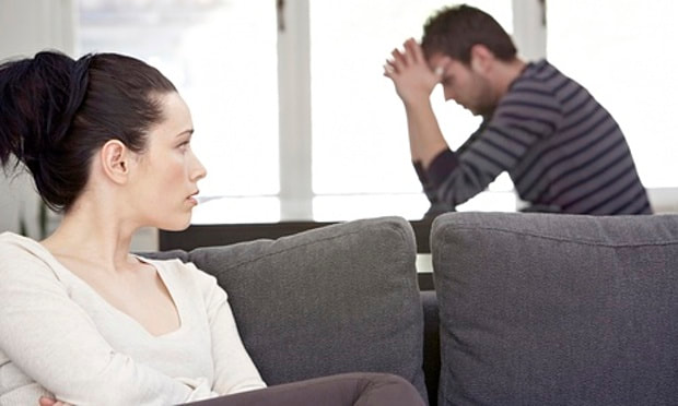 Woman looks concerned with her partner's behavior.